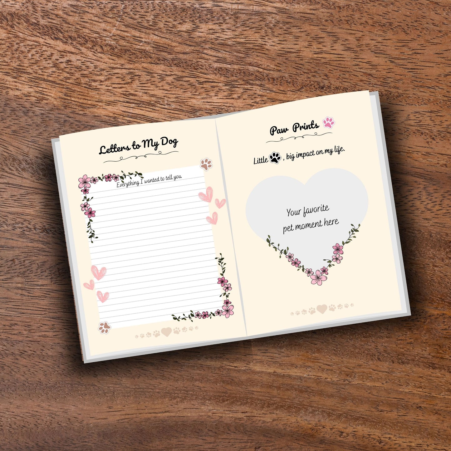 Opened decorated pet memorial journal showing customizable pages on a wooden table
