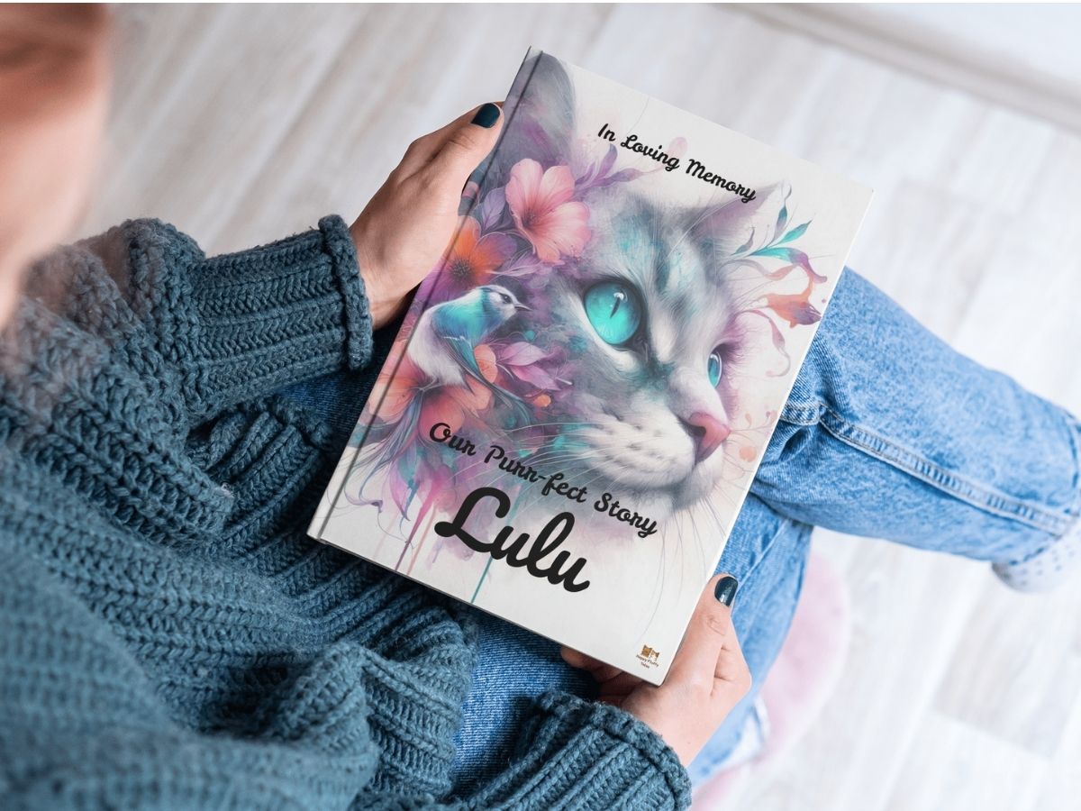 Printed pet memorial book held in hands