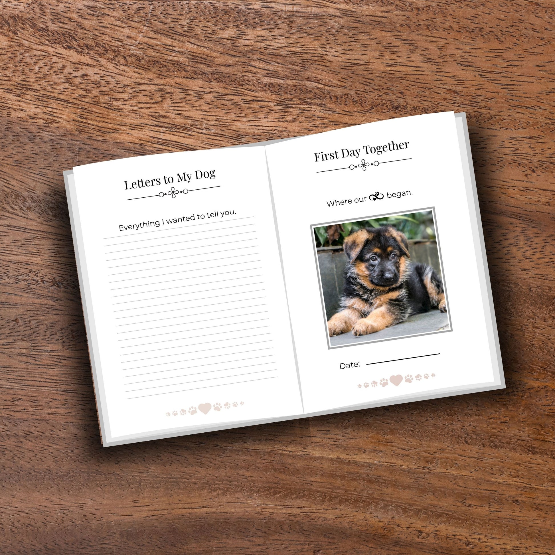 Opened minimalist pet memorial journal showing pages on a wooden table