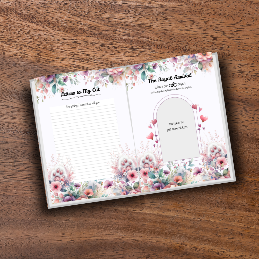 Printed cat memory journal open on wooden table showing decorative pages